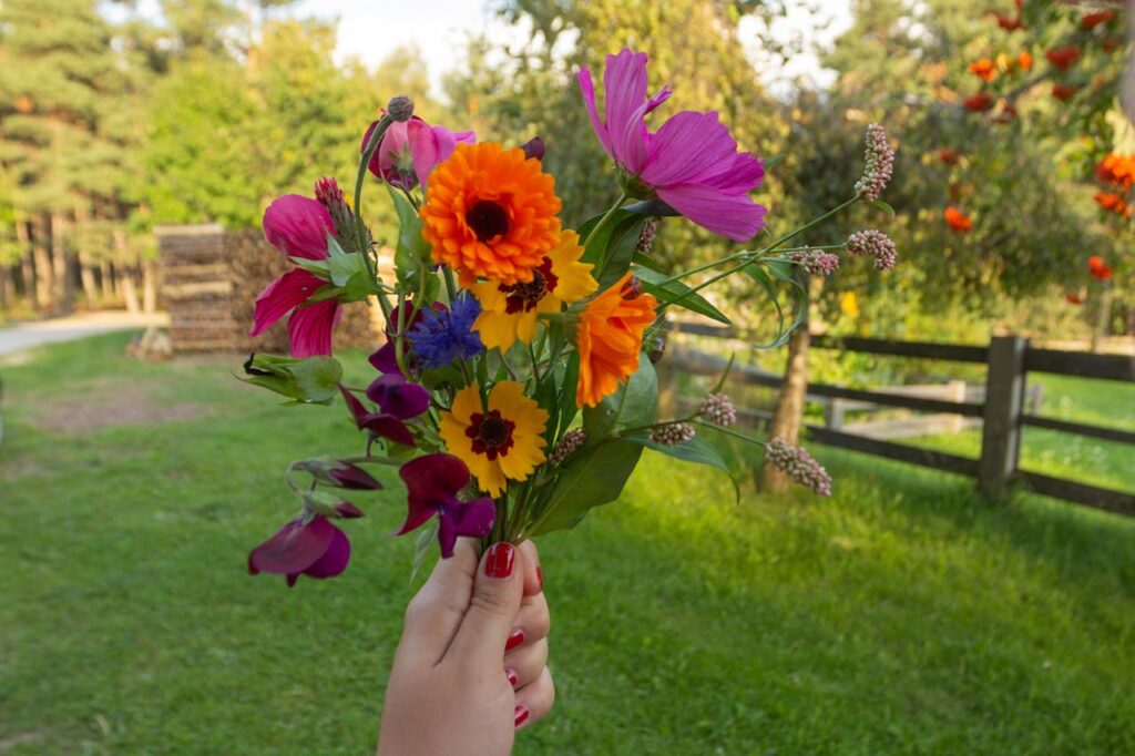 holding a bunch of flowers